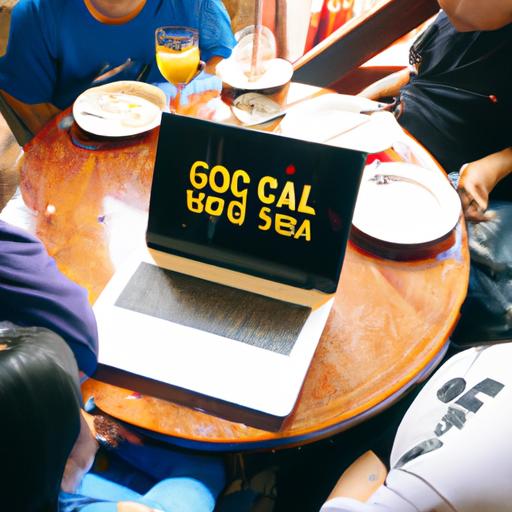 Nhóm người ngồi quanh bàn nhìn vào màn hình laptop viết chữ 'soi cầu XS Gia Lai'